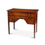 A Regency mahogany and ebony line and dot marquetry dressing table