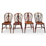 A matched set of four 19th century ash and elm wheel back Windsor chairs, Thames Valley