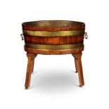 A George III mahogany and brass bound wine cooler on later stand