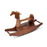 A 19th century folk art teak rocking horse