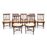 A set of seven George III mahogany dining chairs including a pair of open armchairs