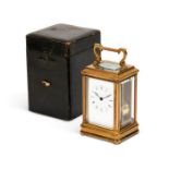 A mid 19th century French lacquered brass bell-striking carriage clock