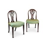 A pair of George III carved mahogany dining chairs