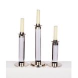 A set of three graduated Walter Prosper perspex and chrome candlesticks