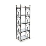 A 20th century wrought iron and glass etagere with scrolling decoration