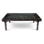 A vintage Balinese ebonised and mother-of-pearl inlaid door table