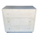 A vintage French white parchment covered chest of drawers