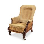 A George IV mahogany upholstered gentleman's library armchair