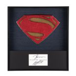 MAN OF STEEL - Framed Promotional Superman Suit Emblem with Henry Cavill and Zack Snyder Autographs