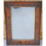 A mahogany mirror with boxwood stringing and gilt slip, 58 by 41cm.