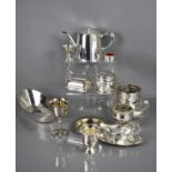 A group of silver plateware to include teapot, sauce boat, platewarmer and other items.