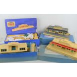 Three boxed Hornby Dublo D1 Through Stations together with an unboxed example