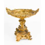 A 19th century gilt bronze Italian tazza, cast with cherubs, baskets of flowers and face masks, 20cm