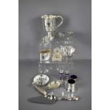 A group of silver plate ware to include a hip flask, ashtray, blue glass lined salt and pepper,