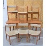 A Mid-Century A.H Mcintosh teak extending dining table and set of seven chairs, model number 9893.
