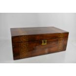 A 19th century rosewood and parquetry banded work box, bearing shield form plaque to the top and