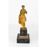 An 18th century gilt bronze figure of a woman holding a lamp, raised on a later 20th century