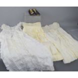 A group of vintage childrens clothing comprising a silk embroidered Christening dress, a turn of the