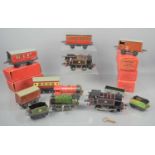 A group of Hornby 0 gauge clockwork locomotives type 20 and type 40 together with a quantity of