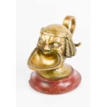 An Italian bronze and red marble inkwell, in the form of a head with open mouth and hinged lid to