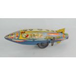 A vintage Marx tinplate clockwork "Moon-Rider" spaceship.