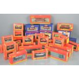 A large group of Hornby and Bachmann 00 gauge railway wagons in original boxes.