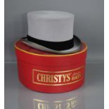 A 20th century Christy's of London grey top hat, with the original box and tags, 7 5/8, 62cm.