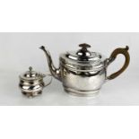 A George III silver tea pot with bright cut engraved decoration and pearwood handle, Thomas Law,