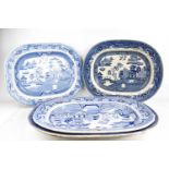 Four Victorian Willow pattern meat platters in blue and white.