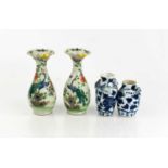 Two Chinese blue and white bud vases, modelled with salamanders to the neck, together with a pair of