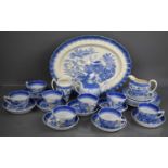 A group of Victorian blue and white pottery, to include oval platter, cups and saucers and jugs.