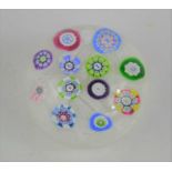 A limited edition Perthshire PP11 glass millefiori paperweight, multiple florettes on white