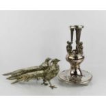 A pair of silver plated pheasants, together with a plated base, 28cm high.