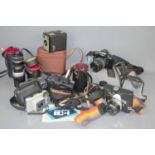 A group of vintage cameras to include Minolta Dynax 5000i, Topcon IC-1 camera with zoom lens,