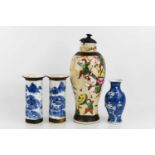 A pair of blue and white Chinese vases, a small bud vase decorated with prunus blossom and a vase