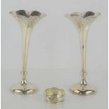 A pair of silver bud vases hallmarked for Chester 1901 together with a silver napkin ring.