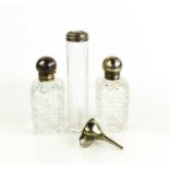 A pair of hobnail cut glass scent or perfume bottles, of rectangular form with silver hinged top and