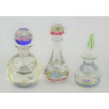 Three millefiori glass scent bottles paperweights by Peter McDougall and Perthshire.
