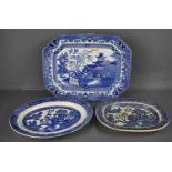 A Victorian blue and white Willow pattern meat platter, and two similar plates.