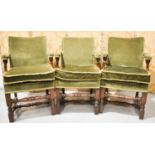A set of three Parker Knoll oak chairs in the 17th century style, upholstered in green velvet with