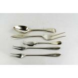 A group of silver to include spoon, fish fork, twin pronged fork, and two white metal examples, 5.