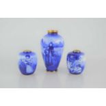 A group of three Royal Doulton "Blue Children" series vases.18cm tall and 10cm tall