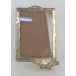 A 1940s silver photograph frame together with a silver bon bon dish with pierced decoration.