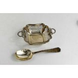 A silver pierced bon bon dish with two bow form decorative handles, together with a sterling