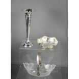 A silver bud vase, a silver and glass bon bon dish, and a glass and silver dish.