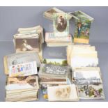 A collection of Edwardian and later postcards together with a group of cigarette cards.