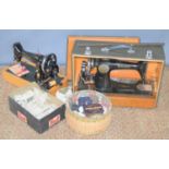 Two vintage Singer sewing machines to include a Singer 99k machine together with a sewing basket and