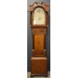 A 19th century mahogany and oak longcase clock, the painted dial surmounted by a moon roller dial