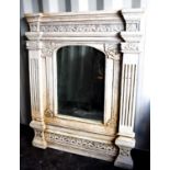 A large tabernacle Italian style painted wall mirror, with fluted columns flanking the arched