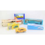 Three boxed Corgi diecast vehicles, boxed Vanguards Mini Cooper and a MGB rear light cover in box.